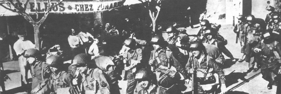 American soldiers march through the streets of Oran after landing. American soldiers march through the streets of Oran after landing.